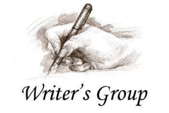 hand holding pen with writers group written under it