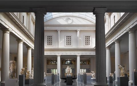 picture from the met of the greek room at the met, showing columns and statues