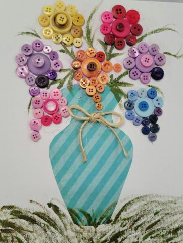  Create an everlasting bouquet of paper flowers and buttons on canvas.