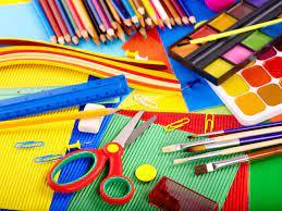 various art supplies scattered across a table