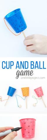 cup on a stick with a ball attached by a string