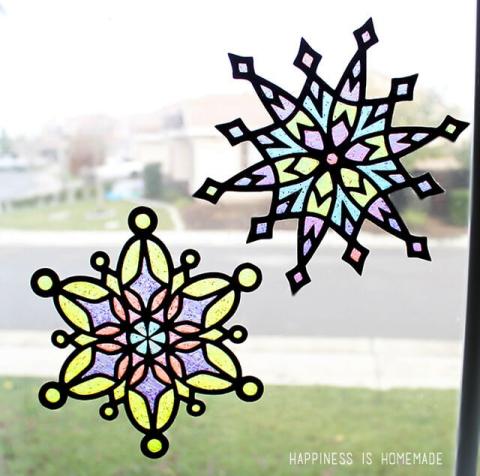 colorful snowflake suncatchers in window