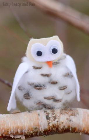 Snowy Owl made of pinecone and batting with white felt wings and head