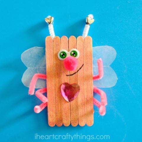 bug with popsicle stick body, wax paper wings, and pipe cleaner legs/antennae