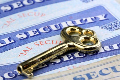 photo of social security cards with key on top