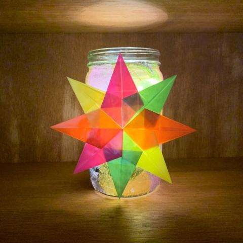 mason jar lantern with colored paper glued into a star