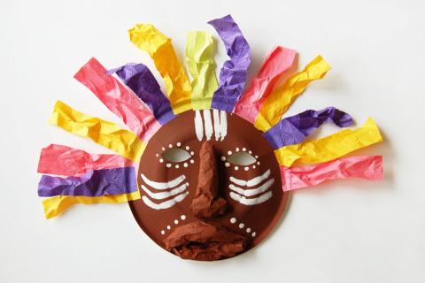 tribal mask made out of painted paper plate and tissue paper