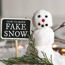 snowman with sign reading how to make fake snow