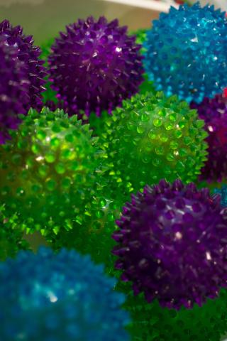Blue, green, and purple clear spiked rubber balls