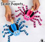 colorful paper spiders attached to popsicle sticks