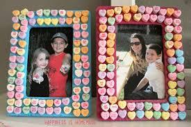 wooden picture frames, painted with conversation hearts glued all over them