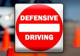 sign that says defensive driving