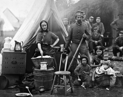 photo of a soldier, a woman, and some children presumably from the civil war