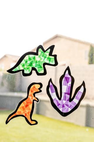 dinosaur shaped suncatchers made with tissue paper