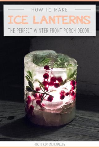 ice lantern with frozen berries and pine needles inside with a candle lit