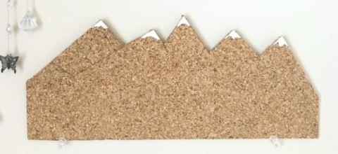 corkboard cut into mountain shape with snowy peaks
