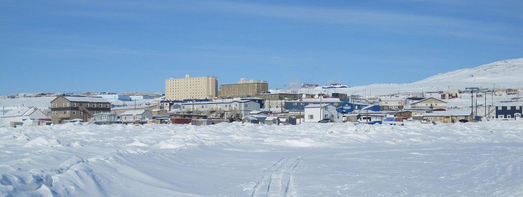 Skyline of downtown Iqaluit in Nunavut Canada. Snow on the ground