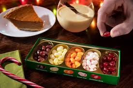 holiday dinner table with various flavors of jellybeans in a tin