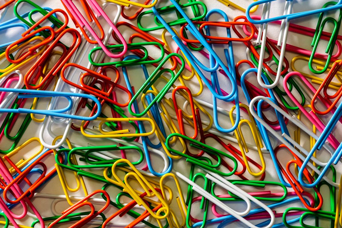 Paperclips of all colors scattered about.