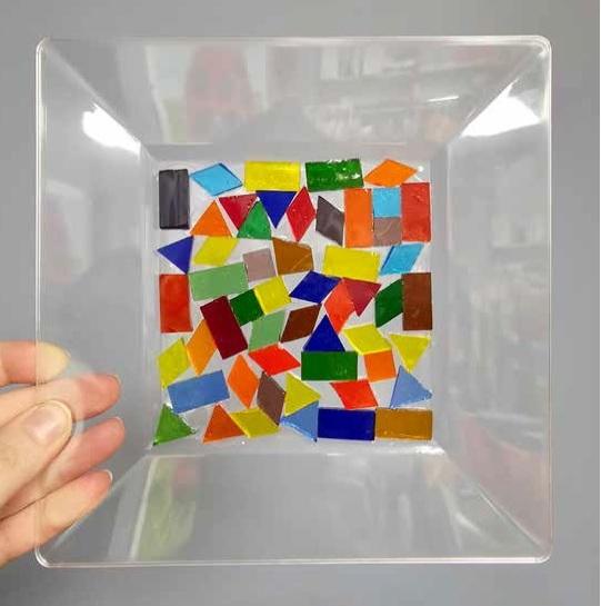 clear plate with mosaic tiles on bottom