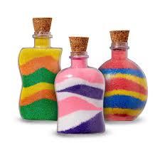 colored sand layered in jars with corks
