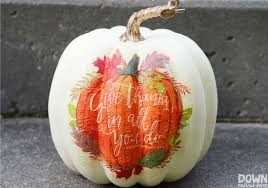 white pumpkin with pumpkin napkin image on it